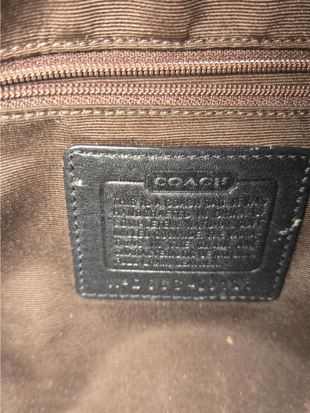 Coach Black Pebbled leather Chelsea turnlock top.